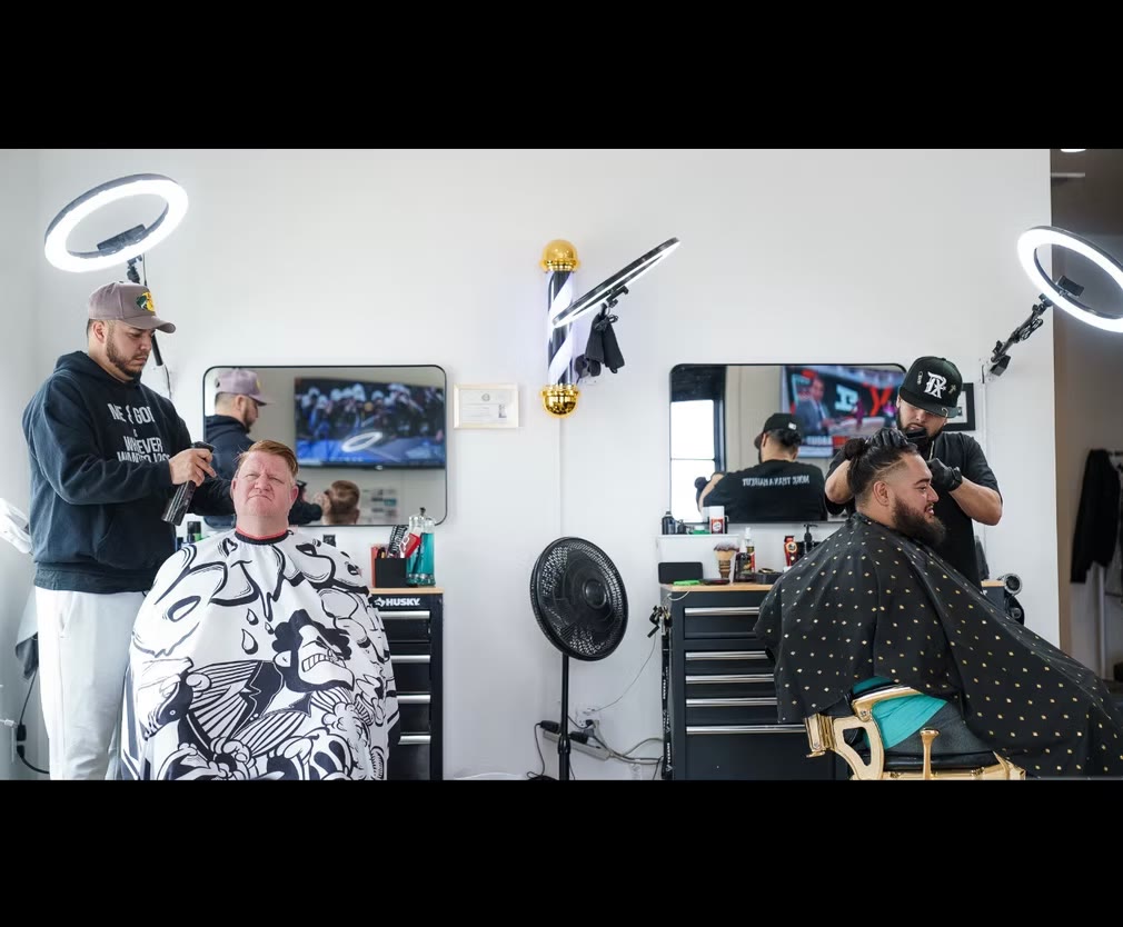 A detailed fade in progress at Crown of Thorns Barbershop