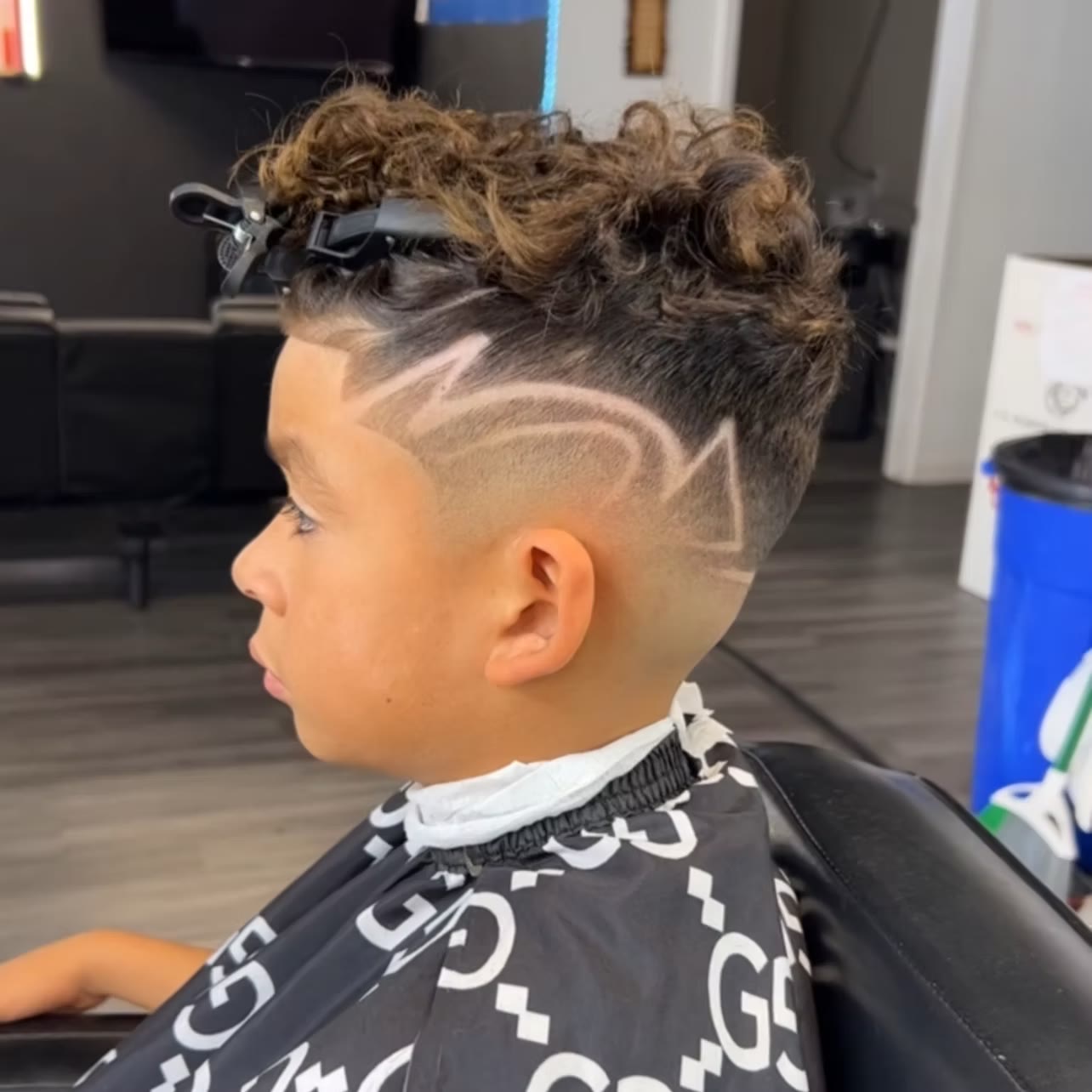 A young guest receiving a haircut at Crown of Thorns